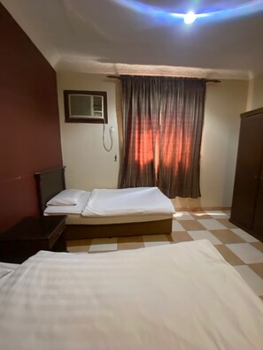 Family Apartment, City View | Premium bedding, pillow-top beds, free WiFi, bed sheets