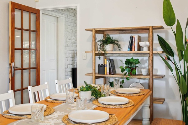 Inviting dining area with simple, modern décor—great for enjoying meals or planning your day.