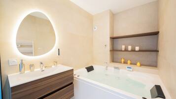 Jetted tub, hair dryer, towels, soap