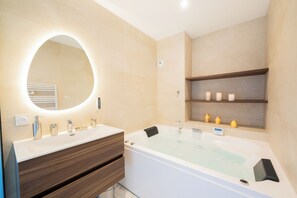 Jetted bath, hair dryer, towels, soap