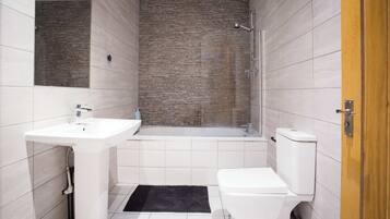 Shower, hair dryer, towels, shampoo