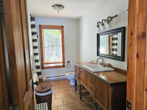 Shower, hair dryer, towels, toilet paper