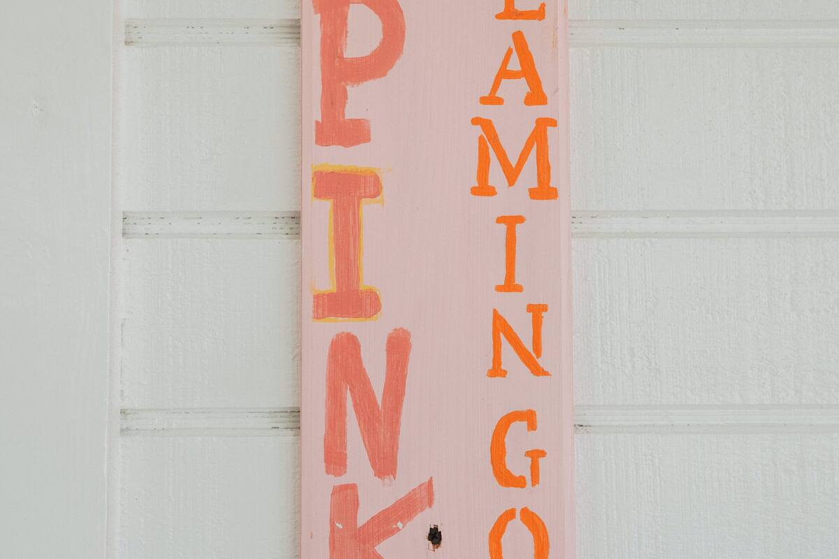 A pink sign with the words "FLAMINGO PINK" and the number "6" on it.