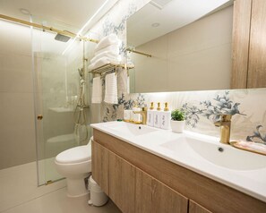 Shower, hair dryer, towels, soap