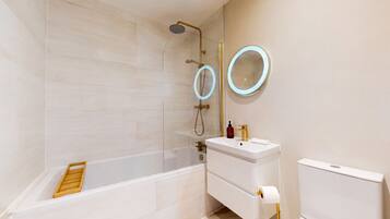 Shower, hair dryer, towels, toilet paper
