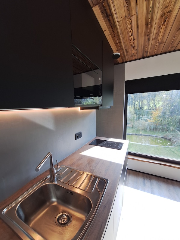 Fridge, microwave, stovetop, coffee/tea maker