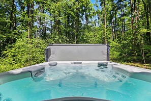 A hot tub surrounded by dense forest. - Harbor Springs Lodge, Less then a mile to Nubs/Highlands
Ski,Golf, Hot Tub, (Harbor Springs)