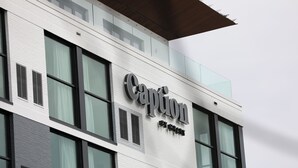 A building with a sign that reads "Caption by Hyatt."