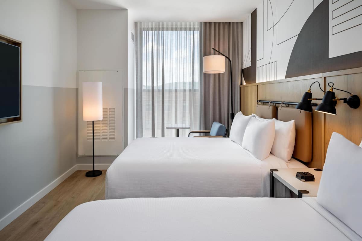 Room, 2 Queen Beds | In-room safe, desk, laptop workspace, blackout drapes