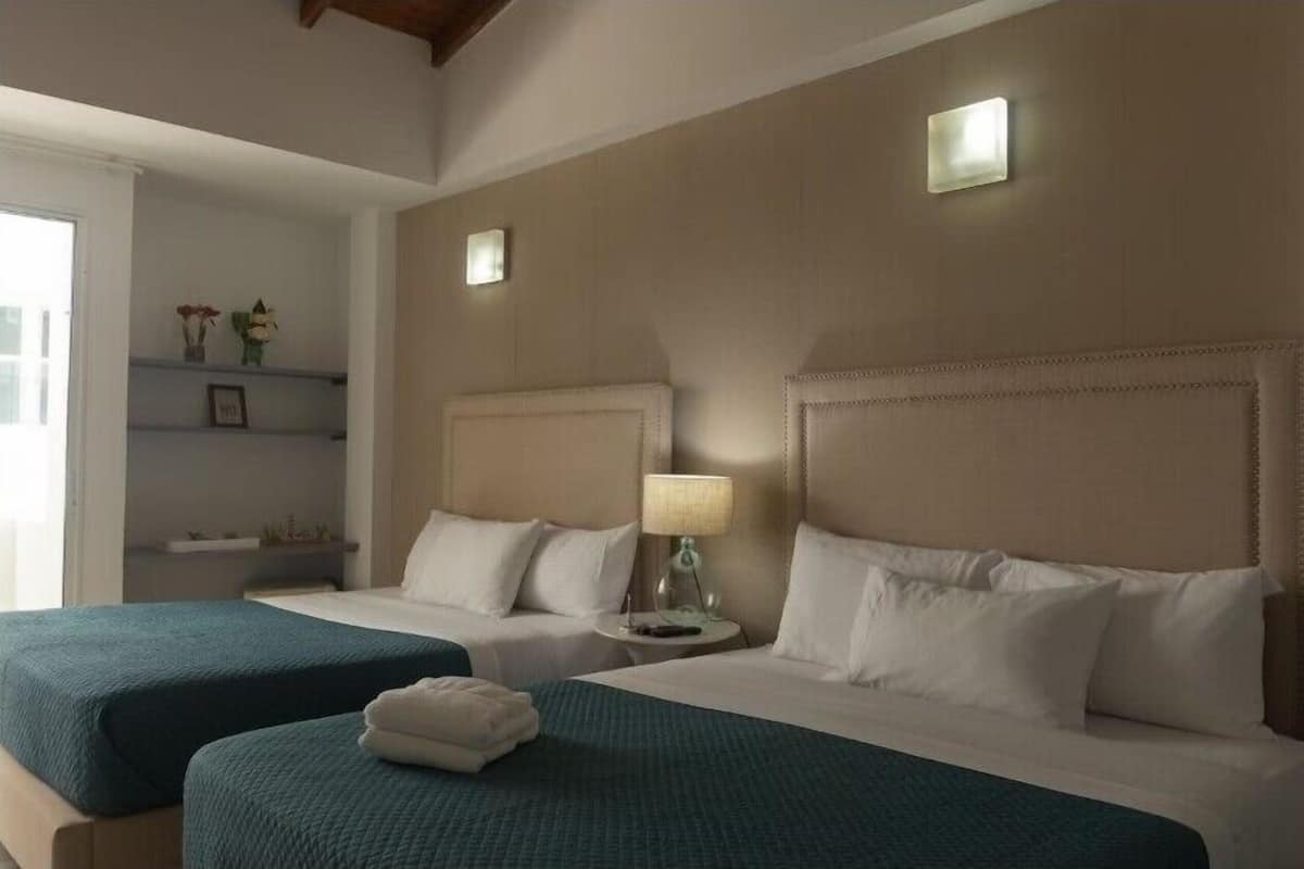 Standard Quadruple Room, Balcony | Desk, laptop workspace, free WiFi