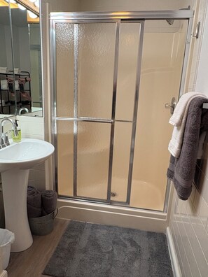Shower, hair dryer, towels, soap