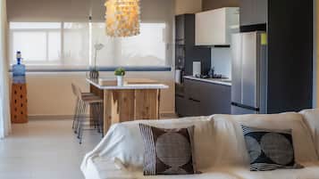 Deluxe Apartment, Balcony, Pool View | Living area