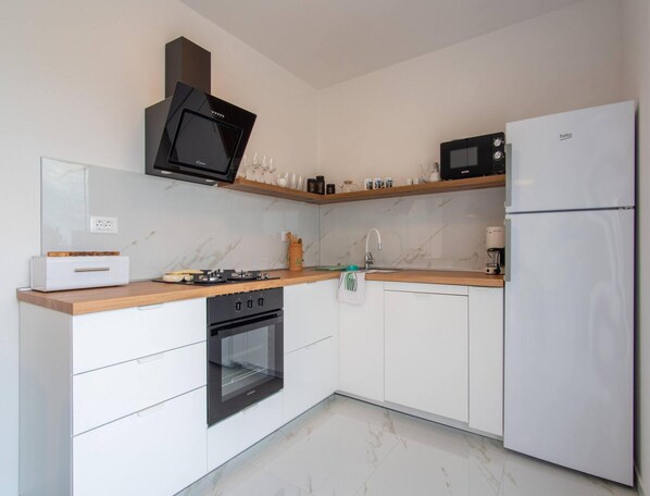 House | Private kitchen | Highchair, cleaning supplies - Beachfront Holiday Home in Kosljun (Pag)