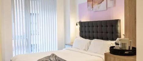 2 dormitorios, tabla de planchar con plancha, wifi gratis y ropa de cama