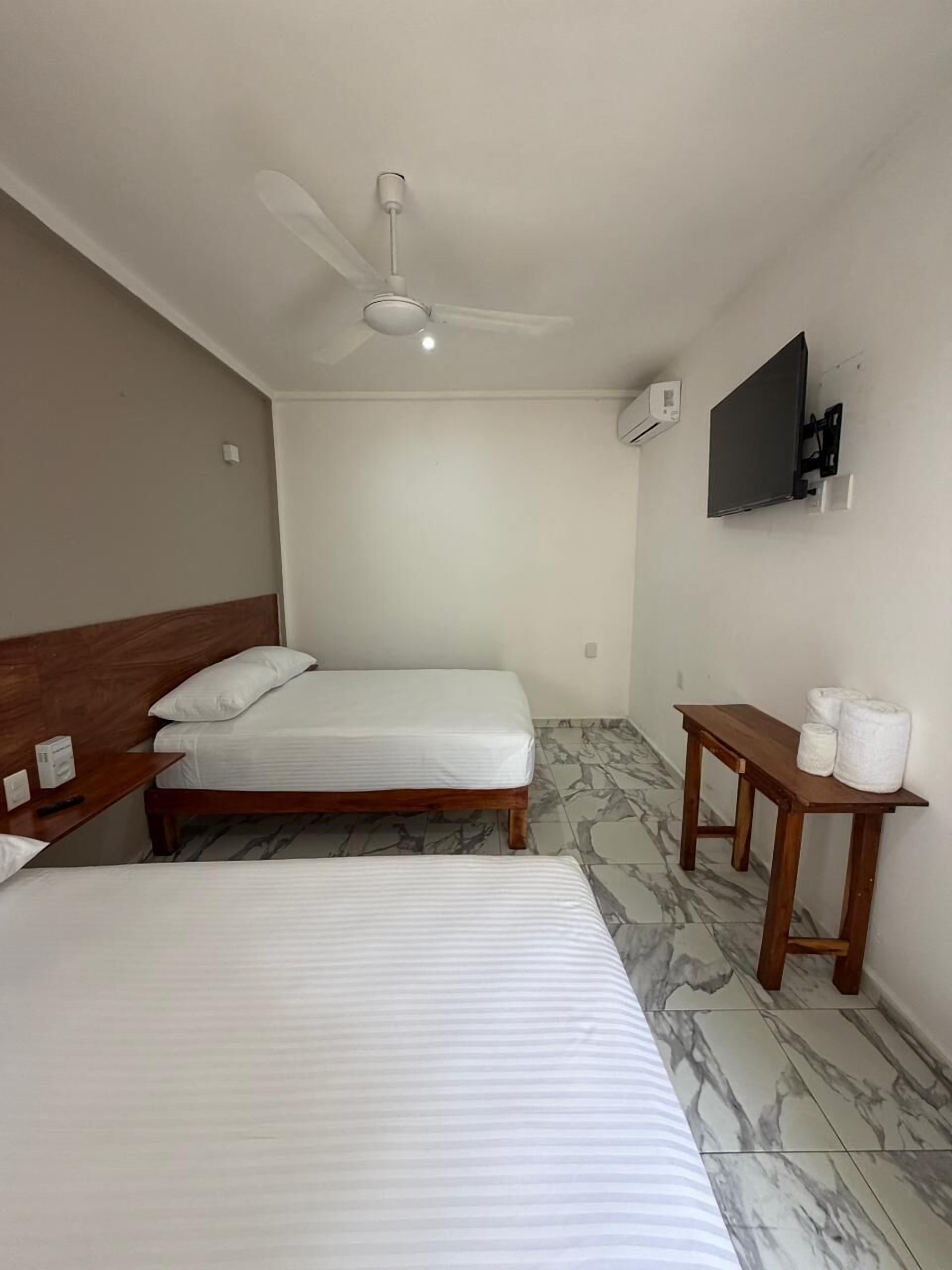 Comfort Quadruple Room, Courtyard View | Iron/ironing board, free WiFi