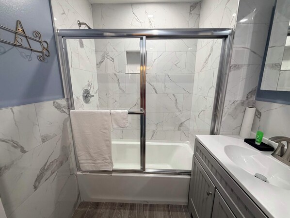 Shower, towels, soap, toilet paper