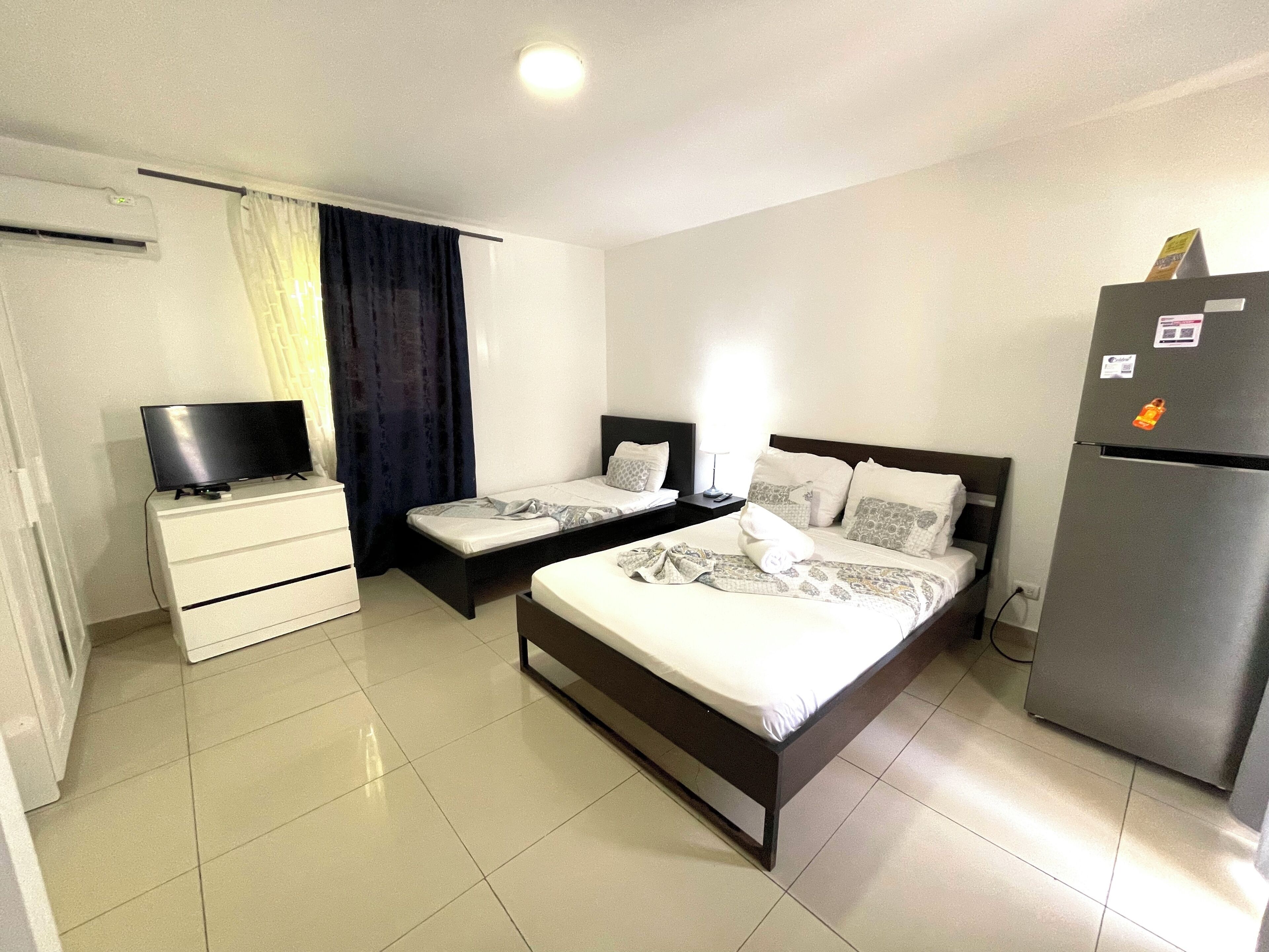 Deluxe Studio, Balcony, Poolside | In-room safe, bed sheets