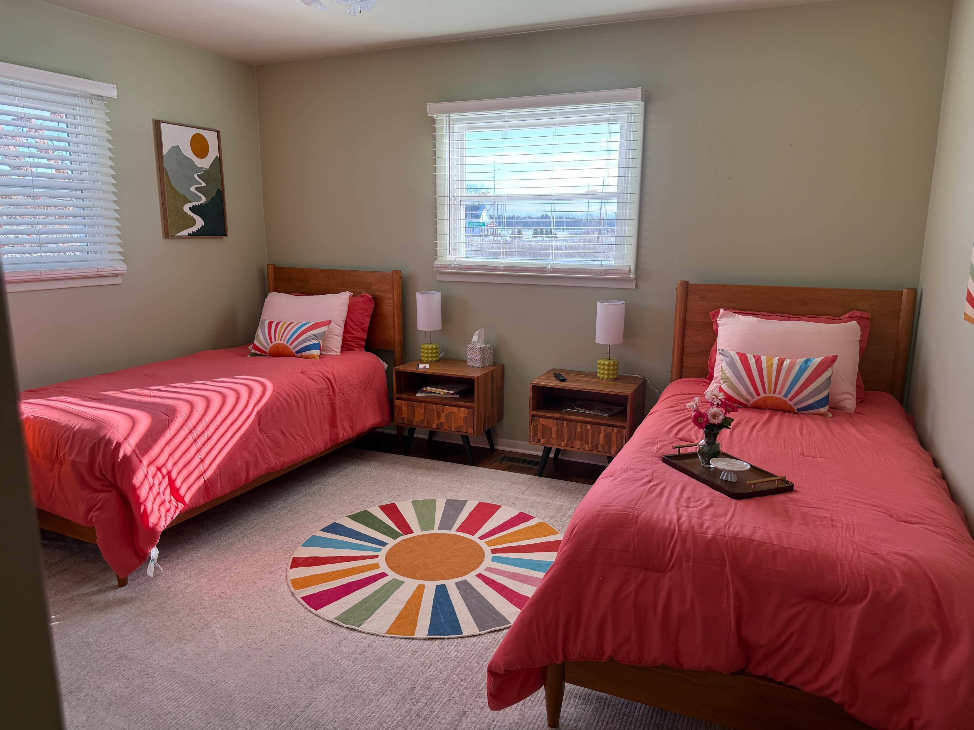 A cheerful kids’ room with pink accents and plenty of room to play