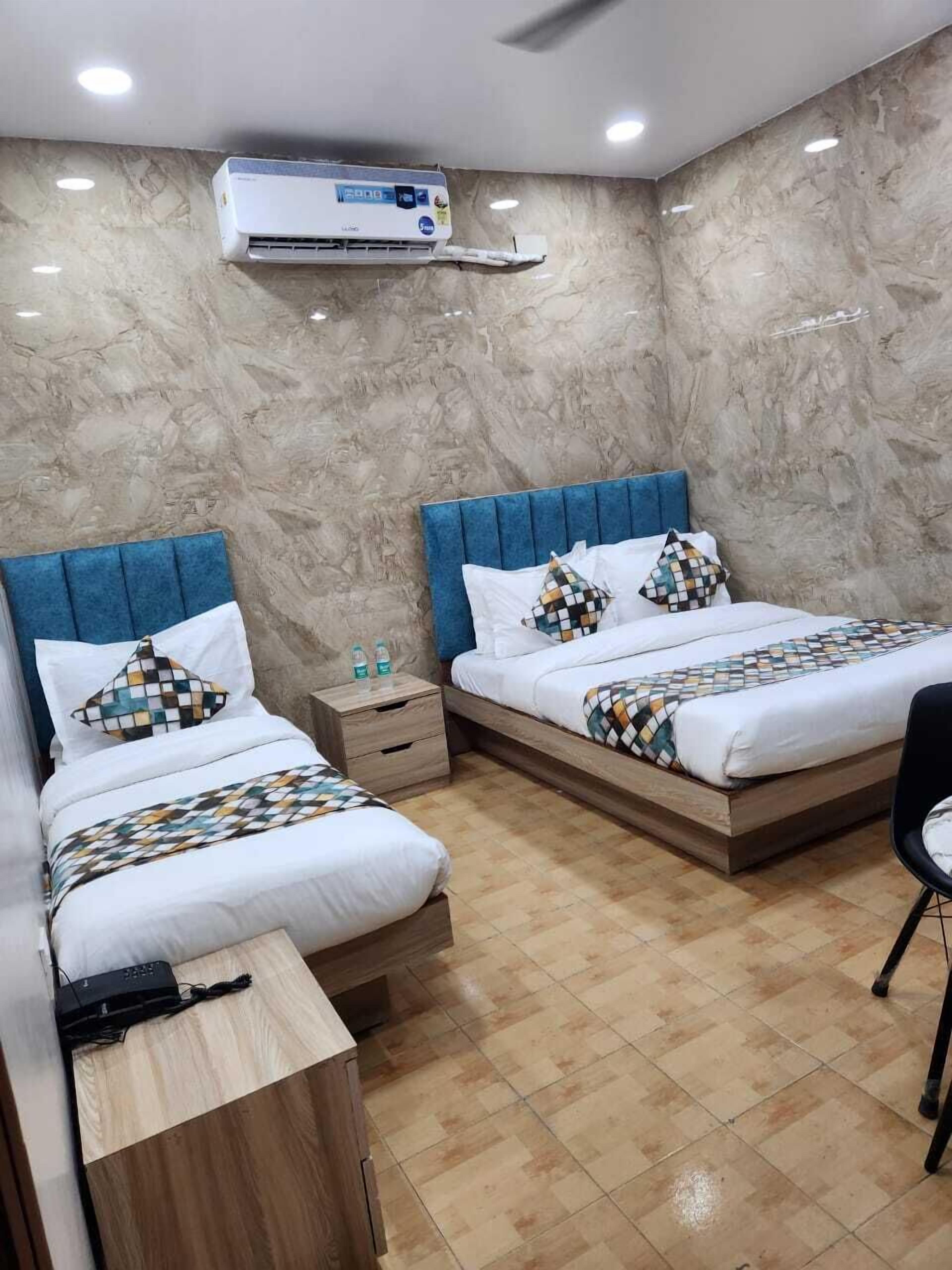 Luxury Triple Room, City View | Desk, laptop workspace