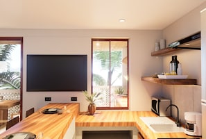 Full-sized fridge, microwave, stovetop, cookware/dishes/utensils