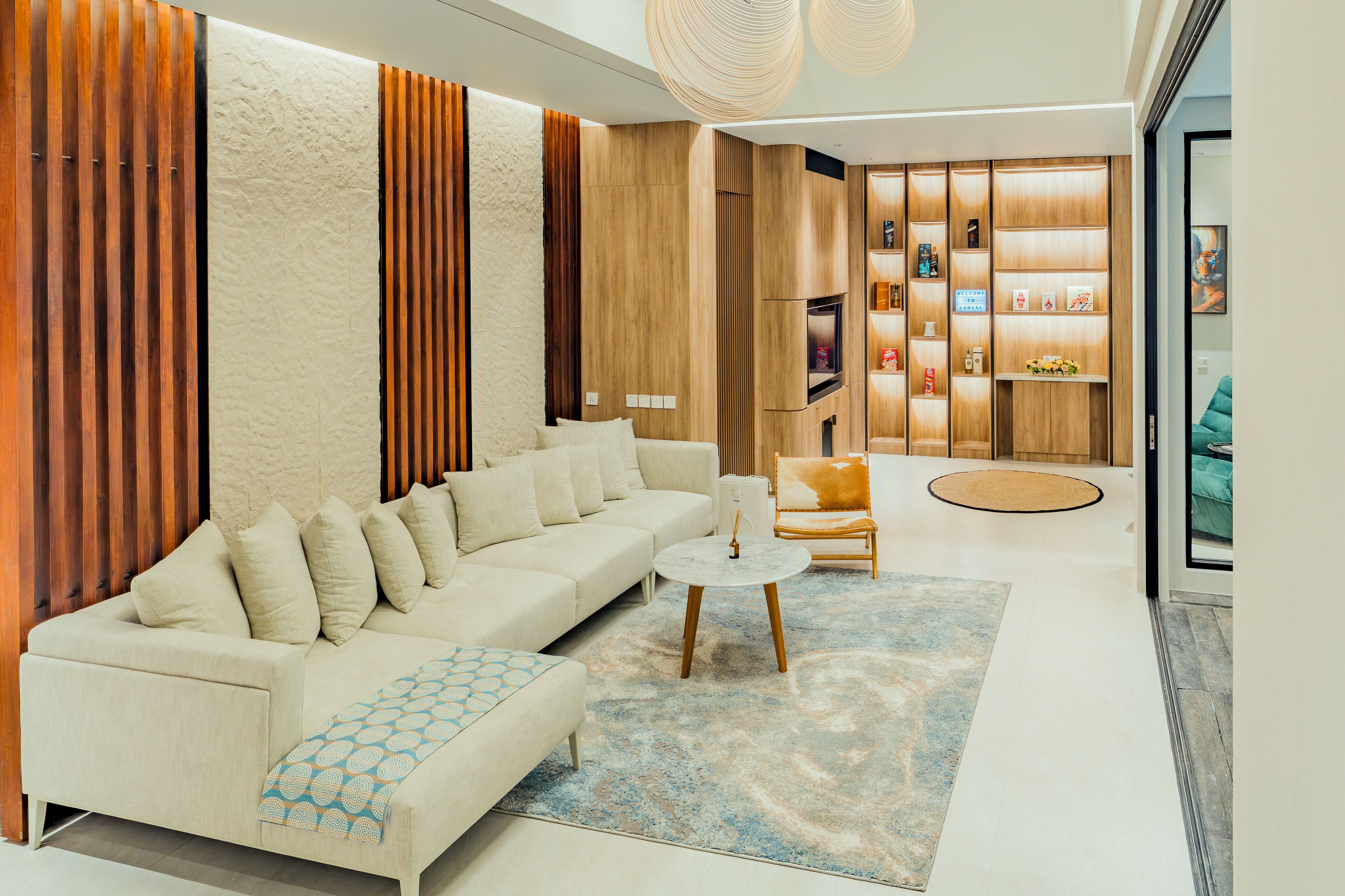 [LIVING ROOM] Chillax in this stylish living space featuring warm wood accents