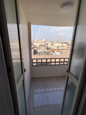 Deluxe Triple Room, Balcony, City View | Terrace/patio