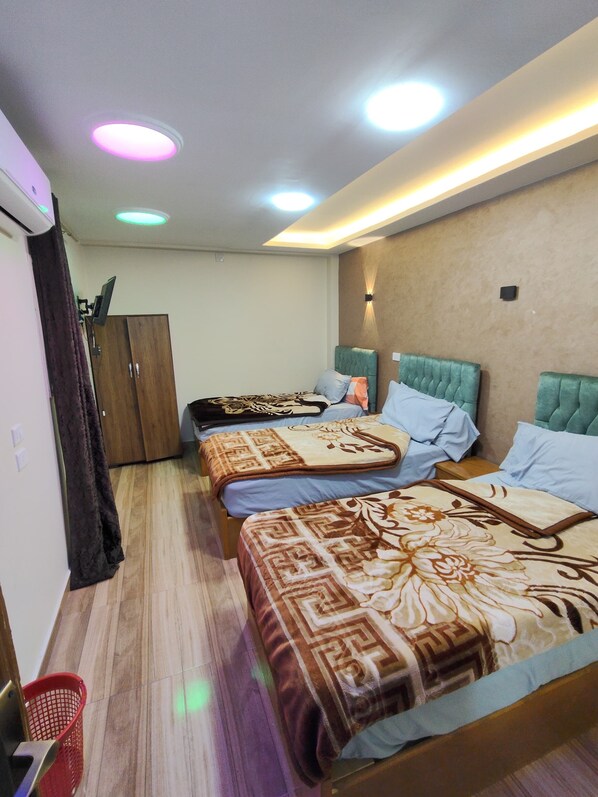 Deluxe Triple Room, Balcony, City View | Blackout drapes, iron/ironing board, free WiFi