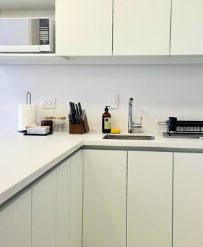 Fridge, microwave, stovetop, coffee/tea maker