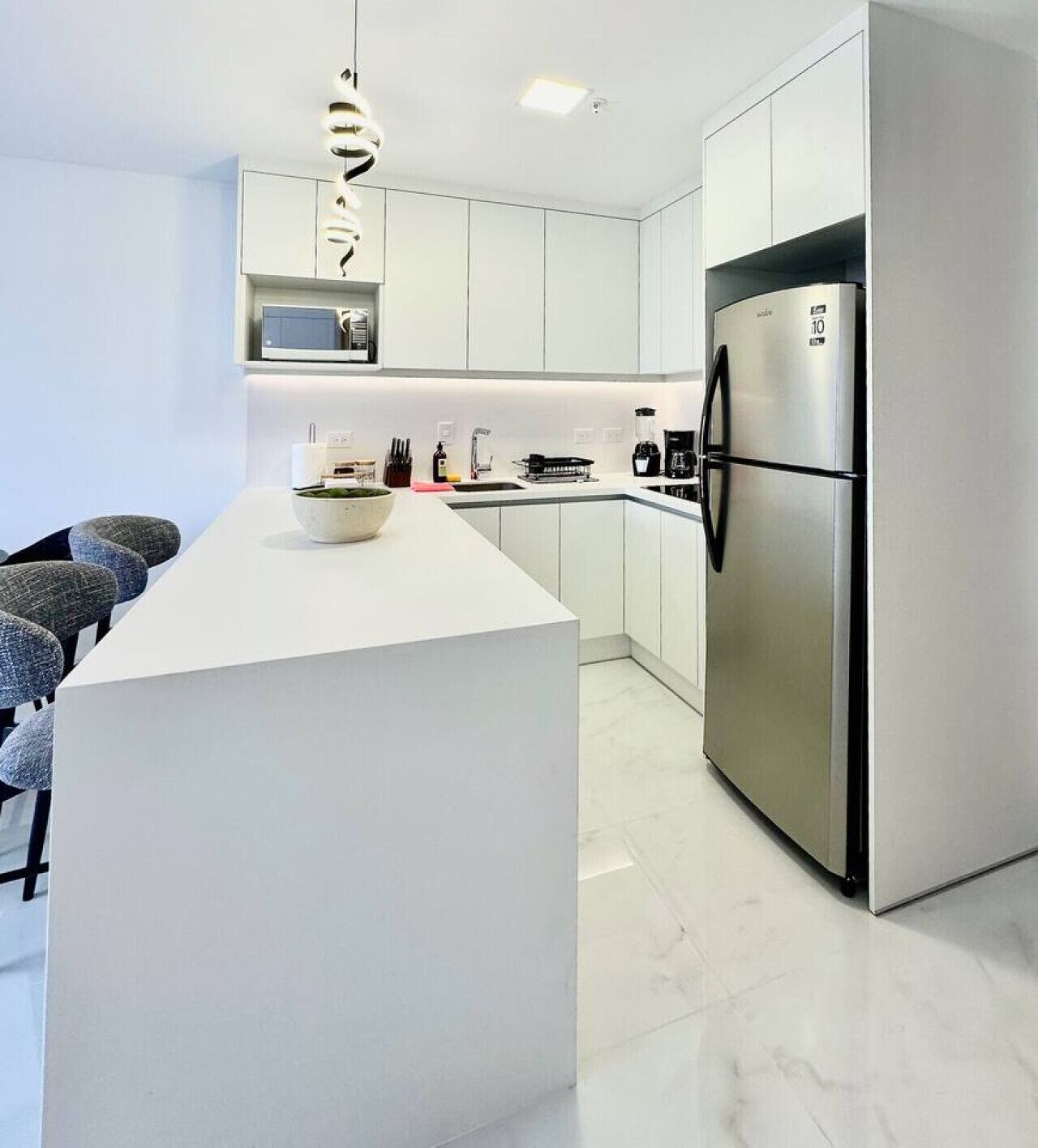 Fridge, microwave, stovetop, coffee/tea maker