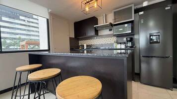 Fridge, microwave, stovetop, coffee/tea maker