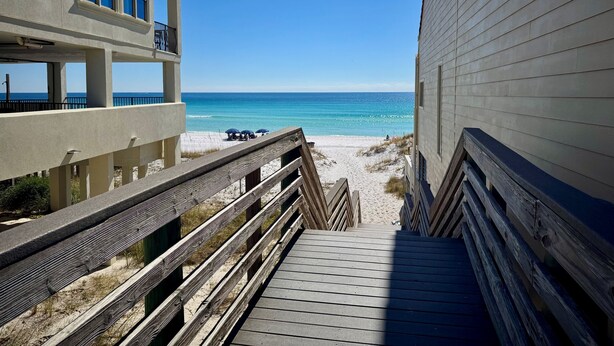A wooden staircase leading to a beach with a clear view of the ocean. - Beautiful 2 bedroom, 2 bath Destin, Florida Condo! (Destin)