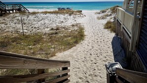 A sandy beach path leading to the ocean with a wooden fence on the right and a wooden structure on the left. - Beautiful 2 bedroom, 2 bath Destin, Florida Condo! (Destin)