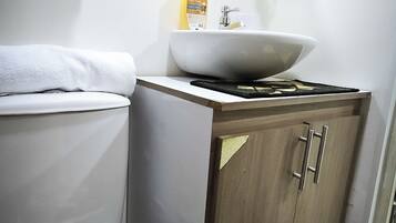 Shower, towels, soap, toilet paper