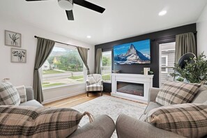 Smart TV, fireplace, table football, books