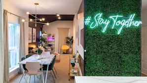 A modern dining area with a marble table, chairs, and a neon sign saying "#Stay Together". - East Austin Pool and Hot Tub Retreat Near Rainey (Austin)