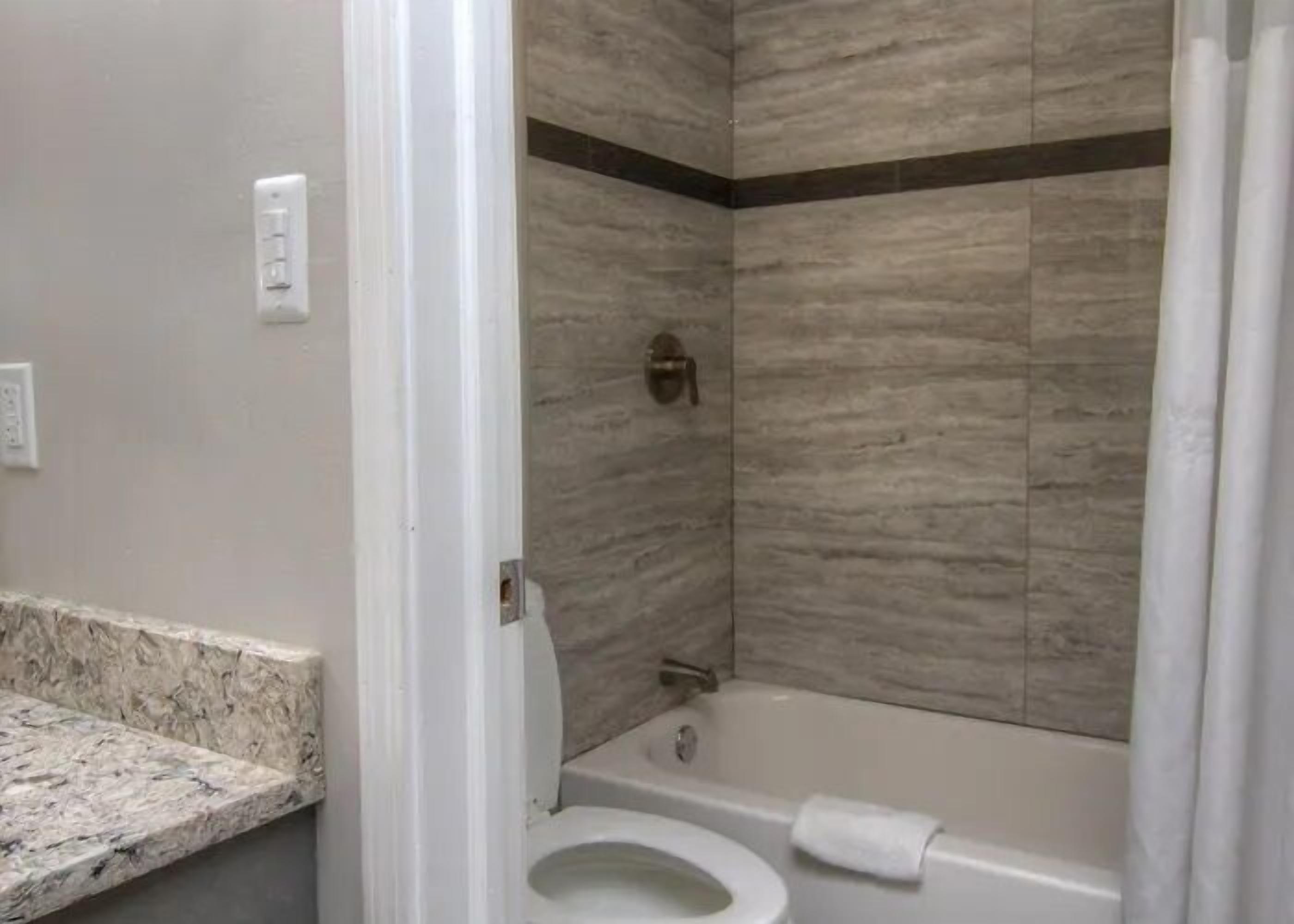 Room, Non Smoking, Kitchenette (2 Full Beds) | Bathroom | Free toiletries, hair dryer, towels
