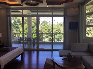 Habitación, 1 habitación, balcón, vistas al jardín | Sala de estar