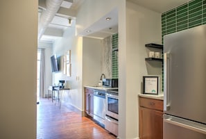 Fridge, microwave, oven, stovetop - The Grove at Heirloom Asheville | Downtown Asheville Pet-Friendly Condo with Private Deck (Asheville)