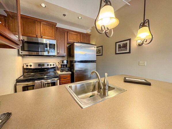 Fridge, microwave, oven, stovetop - The Magnolia | Bright 1BR Asheville Condo | Deck Overlooking City & Mountain Views (Asheville)