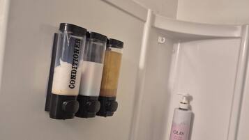 Hair dryer, towels, soap, shampoo