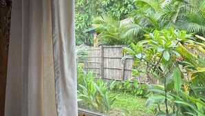 A window with a view of a lush garden, wooden window frame, and a white curtain. - Senbo Eco Resort Cox's Bazar (Cox's Bazar)