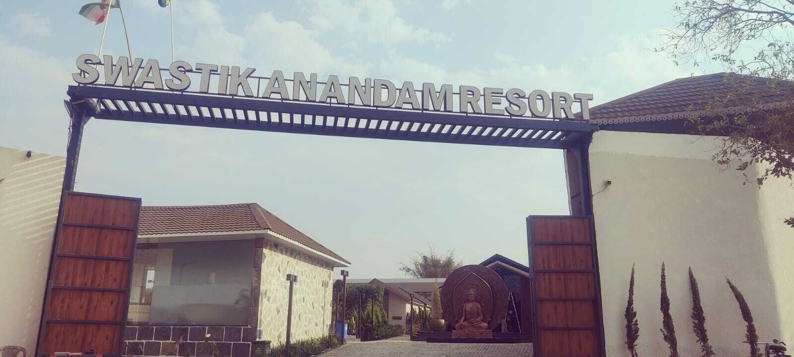 The entrance to Swastik Vandanam Resort with a clear sign above the gate.