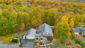 A residential area with houses surrounded by autumn foliage. - Mountain retreat w/deck, game room & dog-friendly (Hedgesville)