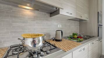 Family House, Multiple Bedrooms, Refrigerator & Microwave (Casa Nadia 1.2 Km from Sea/Near) | Private kitchen | Fridge, microwave, oven, stovetop