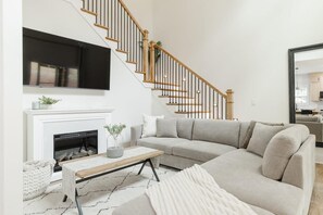 TV, fireplace, books