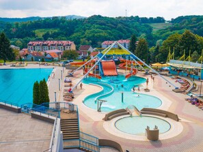 A swimming pool area with a water slide and a separate hot tub. - Stunning private villa for 6 people with pool, A/C, WIFI, TV and terrace (Križevci)