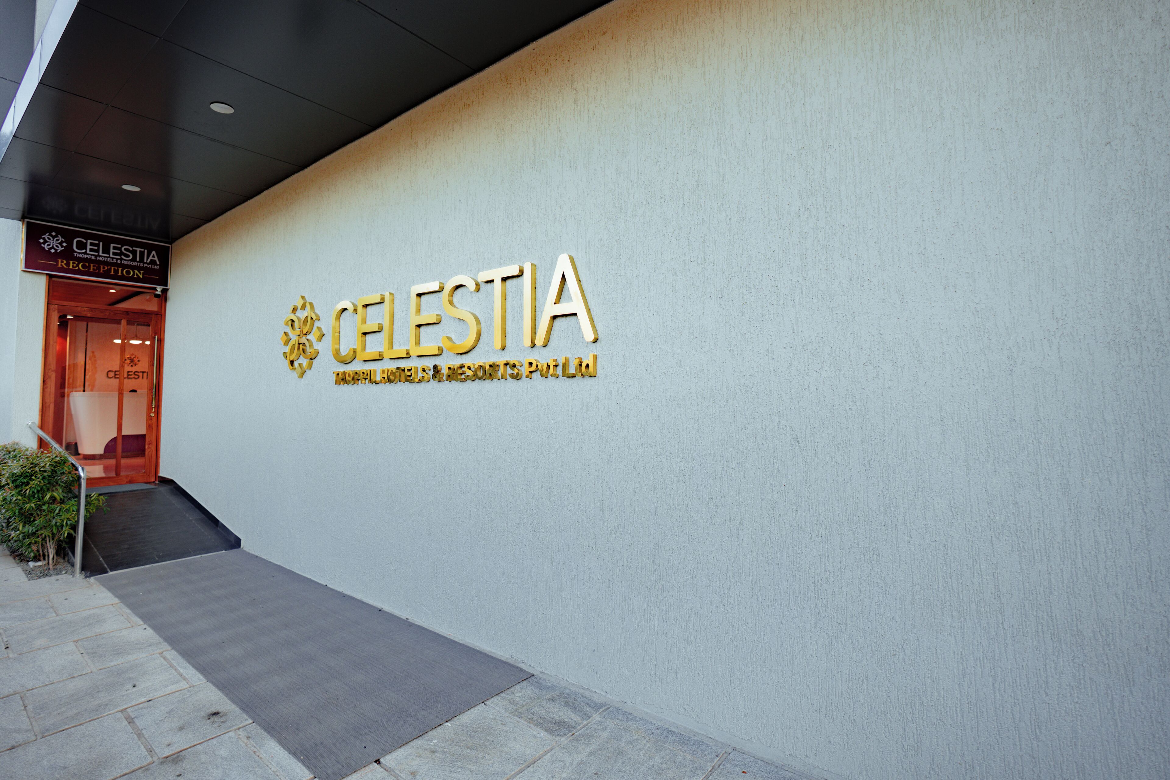 A wall with the Celestia logo and name, indicating a hotel or resort.