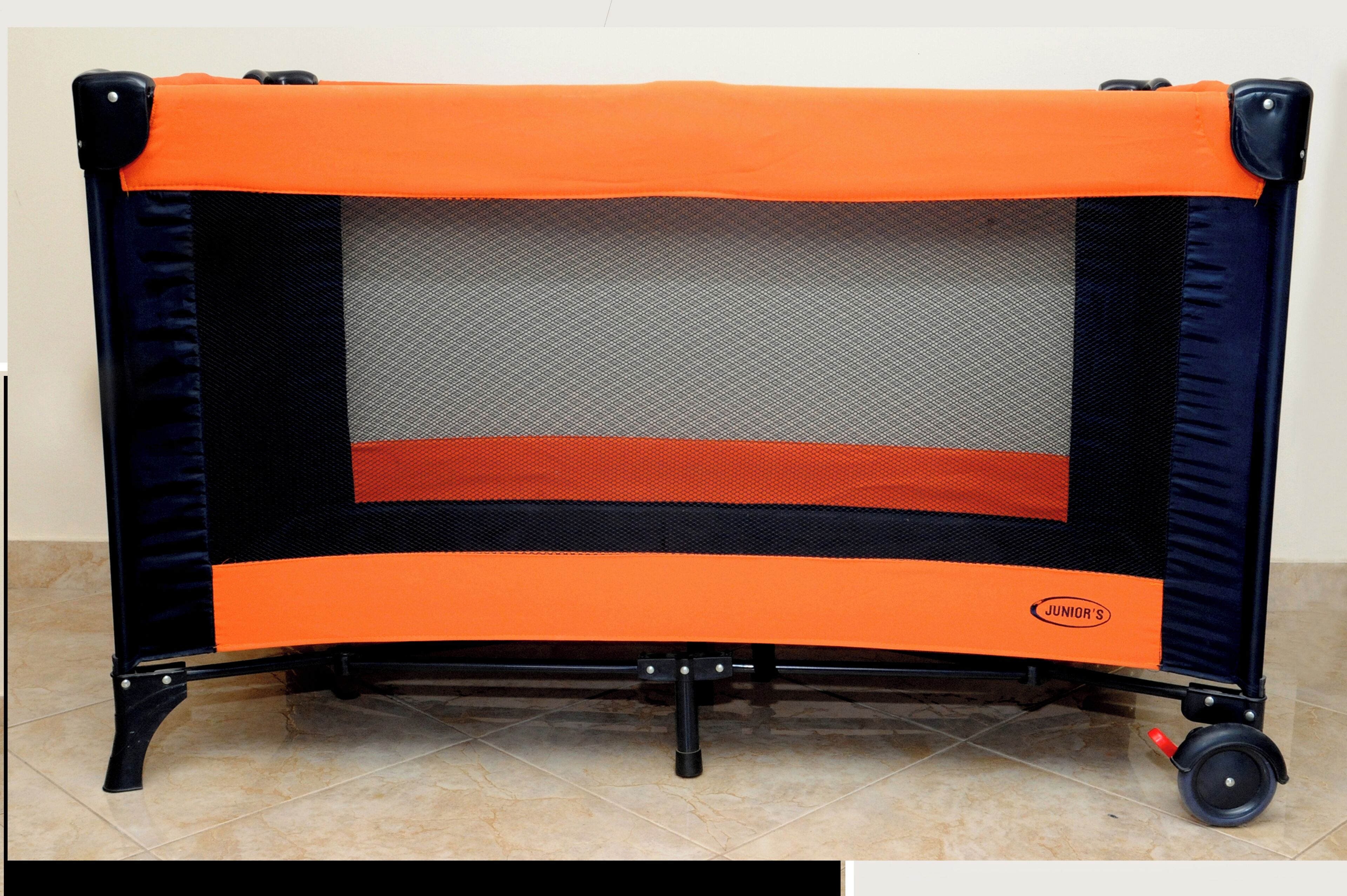 A portable trampoline with a mesh enclosure, featuring a handlebar for mobility and a logo on the side.