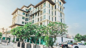 A multi-story building with balconies and large windows. - ZAYN Bangna Hotel (Bangkok)