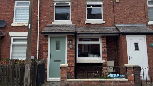 A row of terraced houses with a front door, a window, and a small porch area. - Winsford Woodford Cottage - Sleeps 6 - Pets Ok (Winsford)